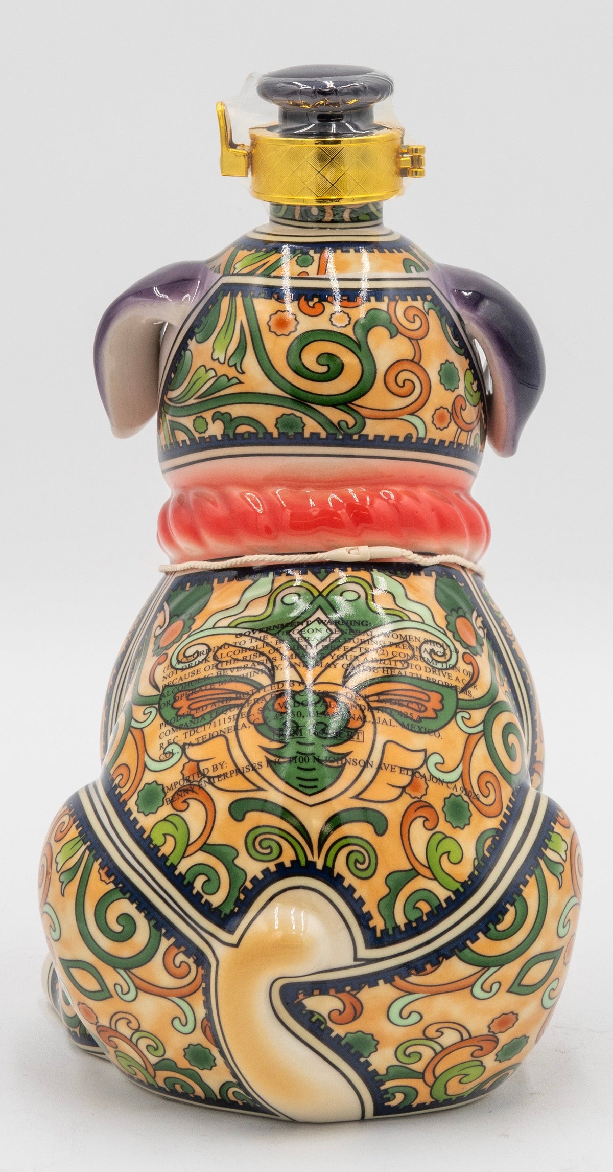 Decorative ceramic bottle with intricate patterns on a white background