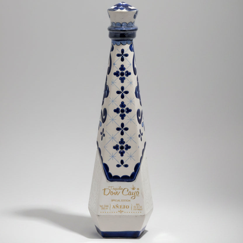 Decorative bottle with blue floral patterns on a white background