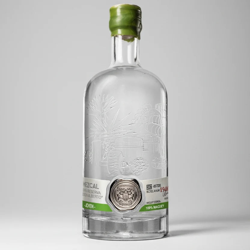 Clear bottle with green cap on a white background