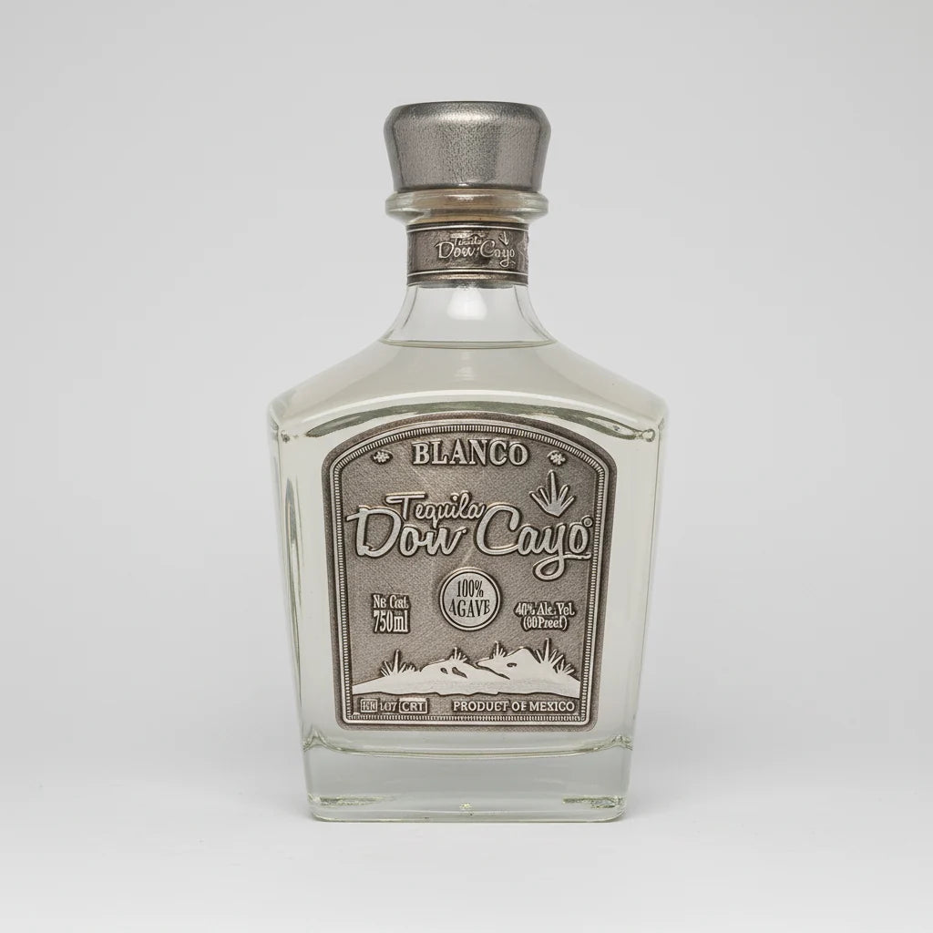 Tequila bottle with silver cap and label on a white background