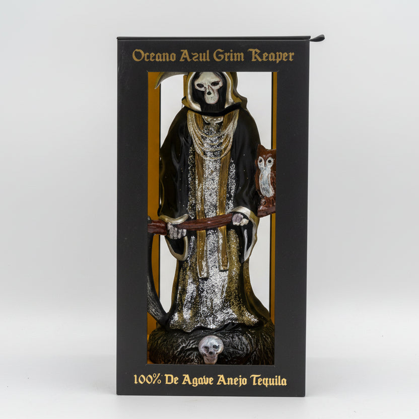 Tequila bottle in a box with a Grim Reaper design on a white background