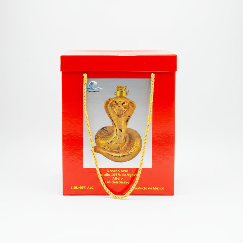 Gold snake-shaped liquor bottle in a red box with 'Oceano Azul' branding.
