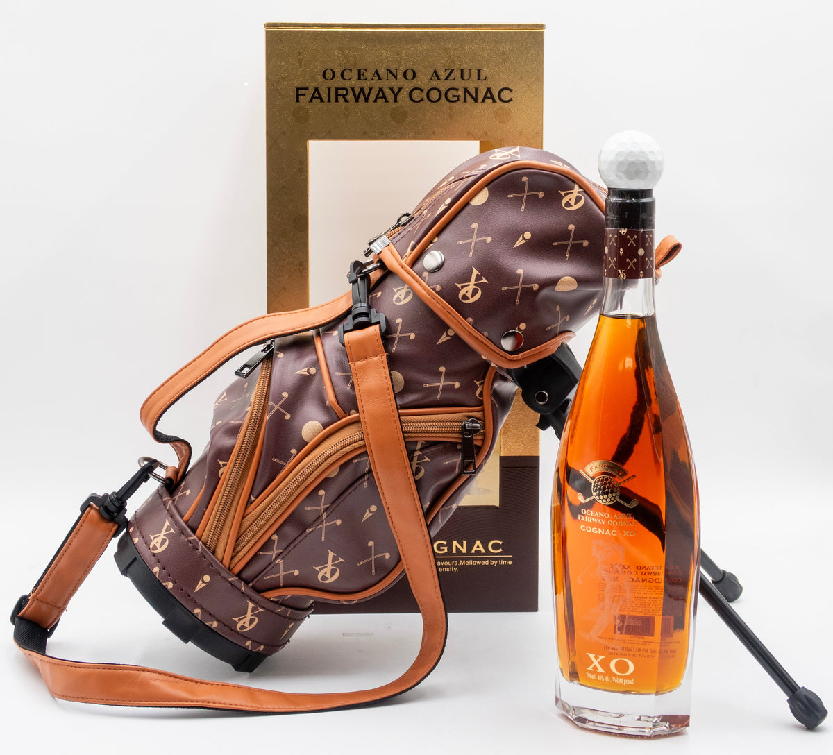 Bottle of Oceano Azul Fairway Cognac with a decorative bag on a white background