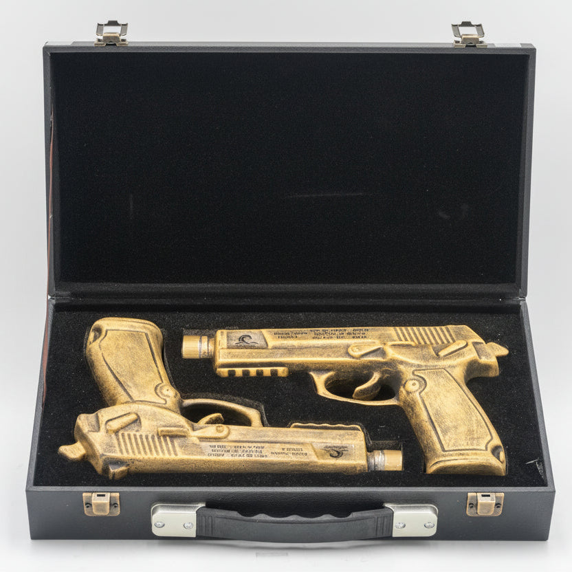 Bronze gun-shaped objects in a black case on a white background