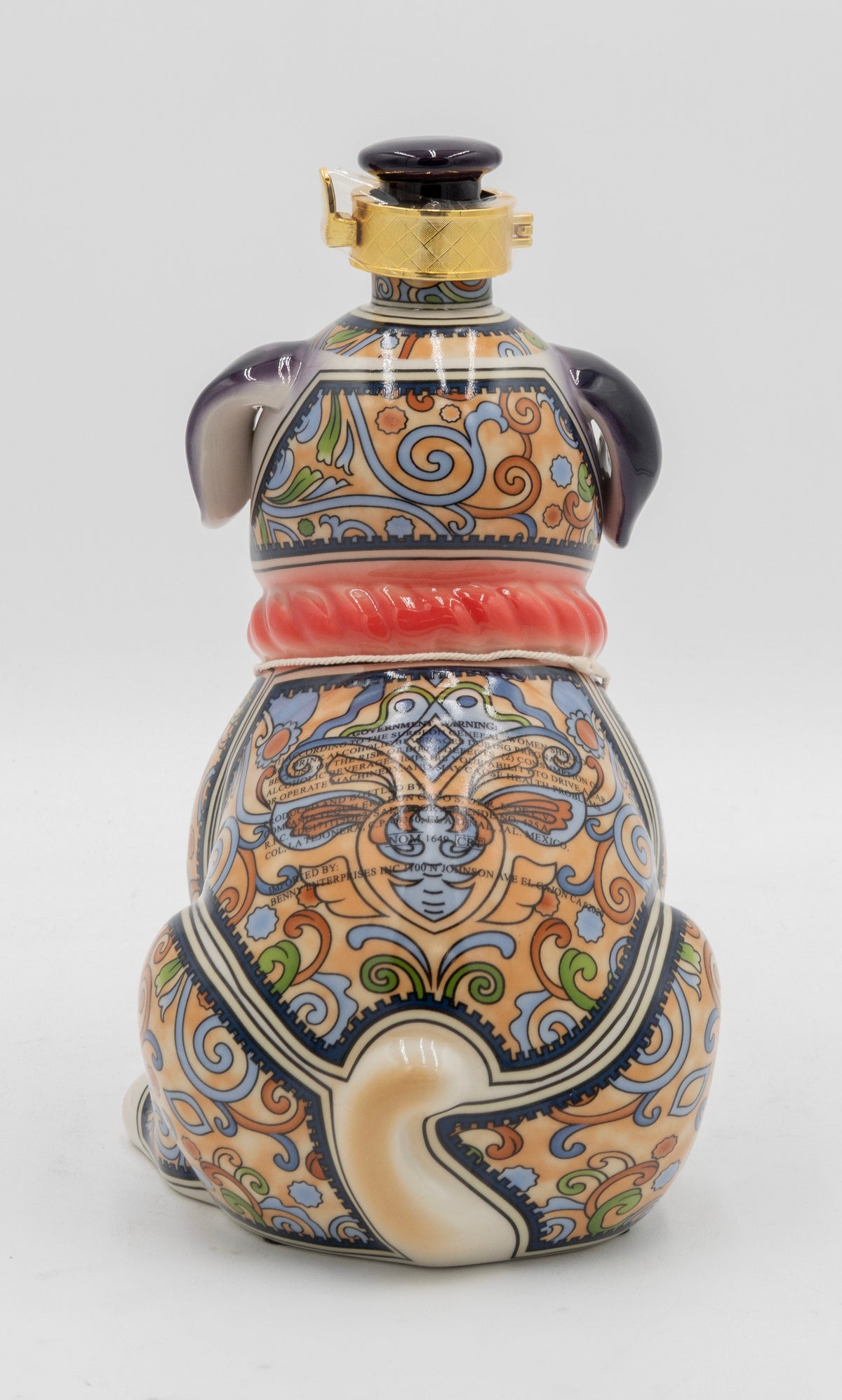 Decorative ceramic bottle with intricate patterns on a white background