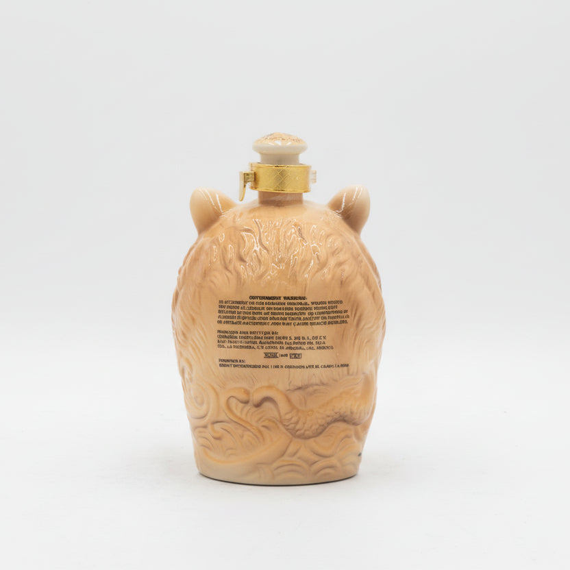 Decorative tiger bottle with intricate designs on a white background