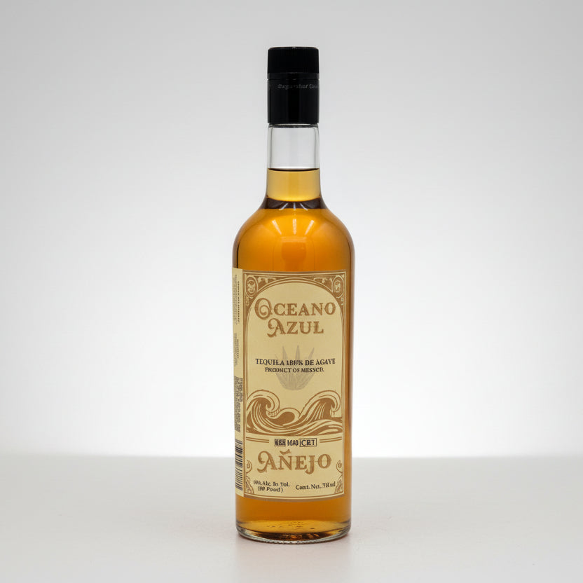 A bottle of Oceano Azul Anejo Tequila with a label showcasing the brand name and type of tequila. The bottle is clear with a visible golden amber liquid and a black cap.