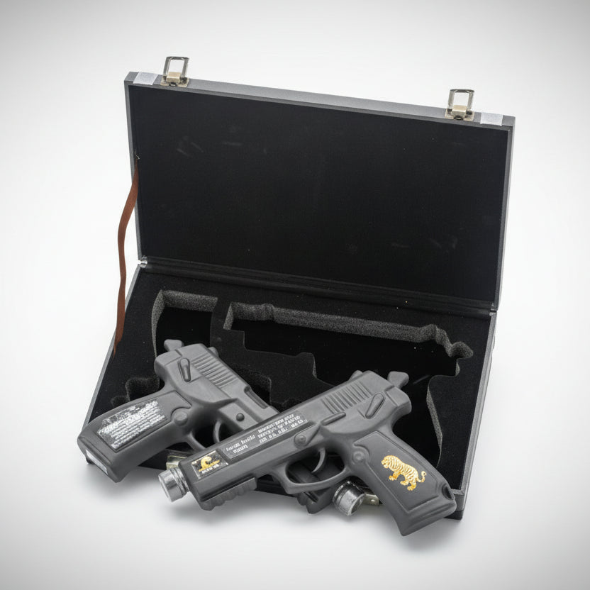 Two 200ml pistol-shaped vodka bottles in a black collector's case