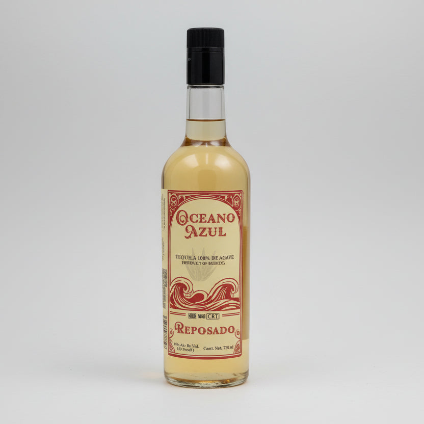 A bottle of Oceano Azul Reposado Tequila with a label showcasing the brand name and type of tequila. The bottle is filled with a golden liquid.