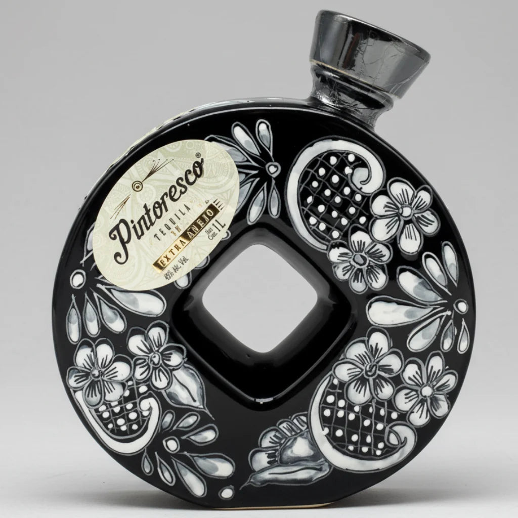 Decorative bottle with floral patterns and 'Piatoresto' branding on a white background